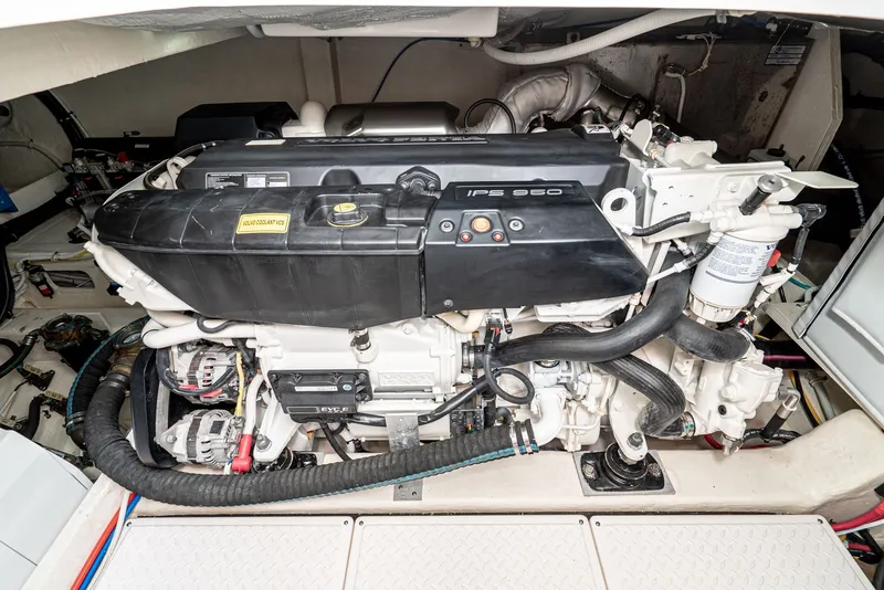 Slide: The Image of Engine room of the 2017 Tiara Yachts C53 Coupe featuring a powerful engine. - 38