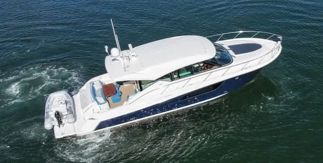 Slide: The Image of A luxurious 2017 Tiara Yachts C53 Coupe cruising on calm waters. - 3