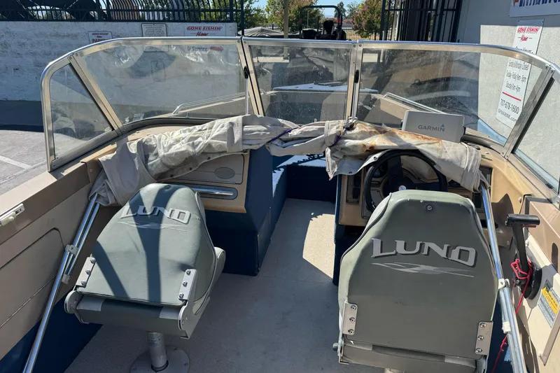 Slide: The Image of 1998 Lund 1700 Pro Sport boat interior with Garmin navigation system and Lund-branded seats. - 15