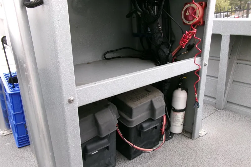 Slide: The Image of 2017 Klamath Bayrunner 19 Baja boat interior showing battery compartment and wiring. - 10
