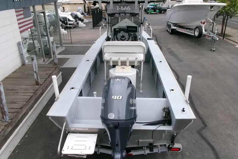 Slide: The Image of 2017 Klamath Bayrunner 19 Baja boat with Yamaha 90 engine, parked at a dealership. - 18