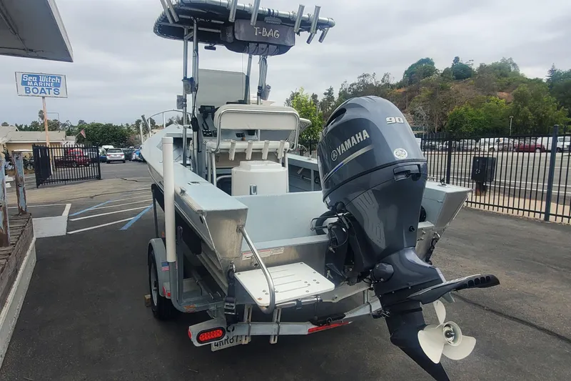 Slide: The Image of 2017 Klamath Bayrunner 19 Baja boat with Yamaha 90 engine at a marine dealership. - 3