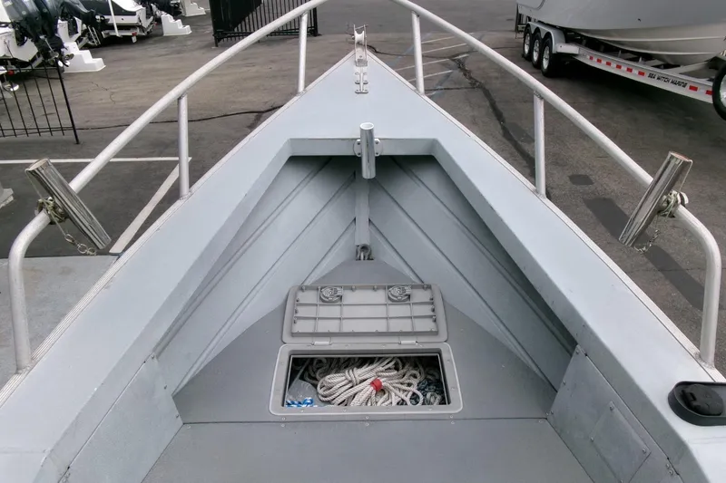 Slide: The Image of 2017 Klamath Bayrunner 19 Baja boat deck with open storage compartment. - 6