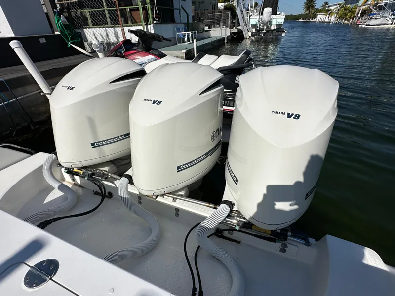 Slide: The Image of Triple Yamaha V8 outboard engines on a 2008 Everglades 350 CC boat. - 11