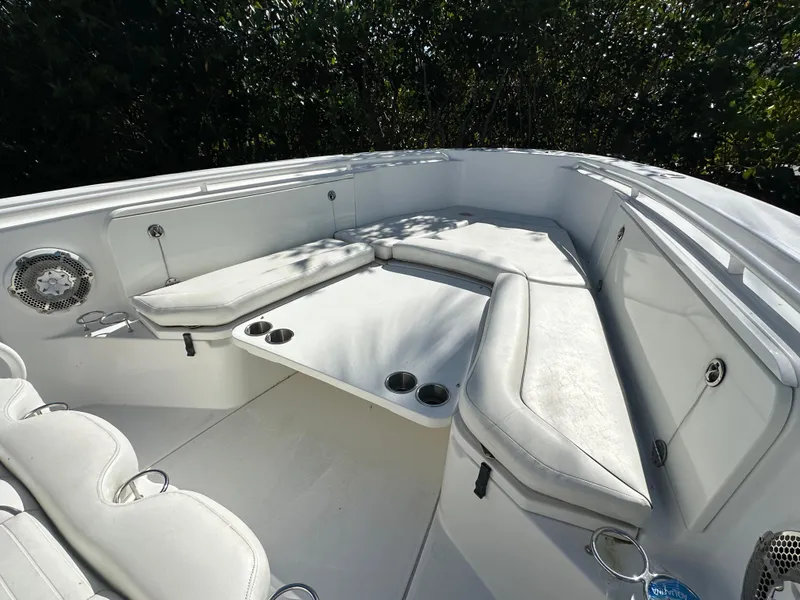 Slide: The Image of 2008 Everglades 350 CC boat interior with white seating and cup holders. - 15