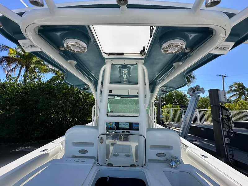 Slide: The Image of 2008 Everglades 350 CC boat interior with modern dashboard and canopy. - 25