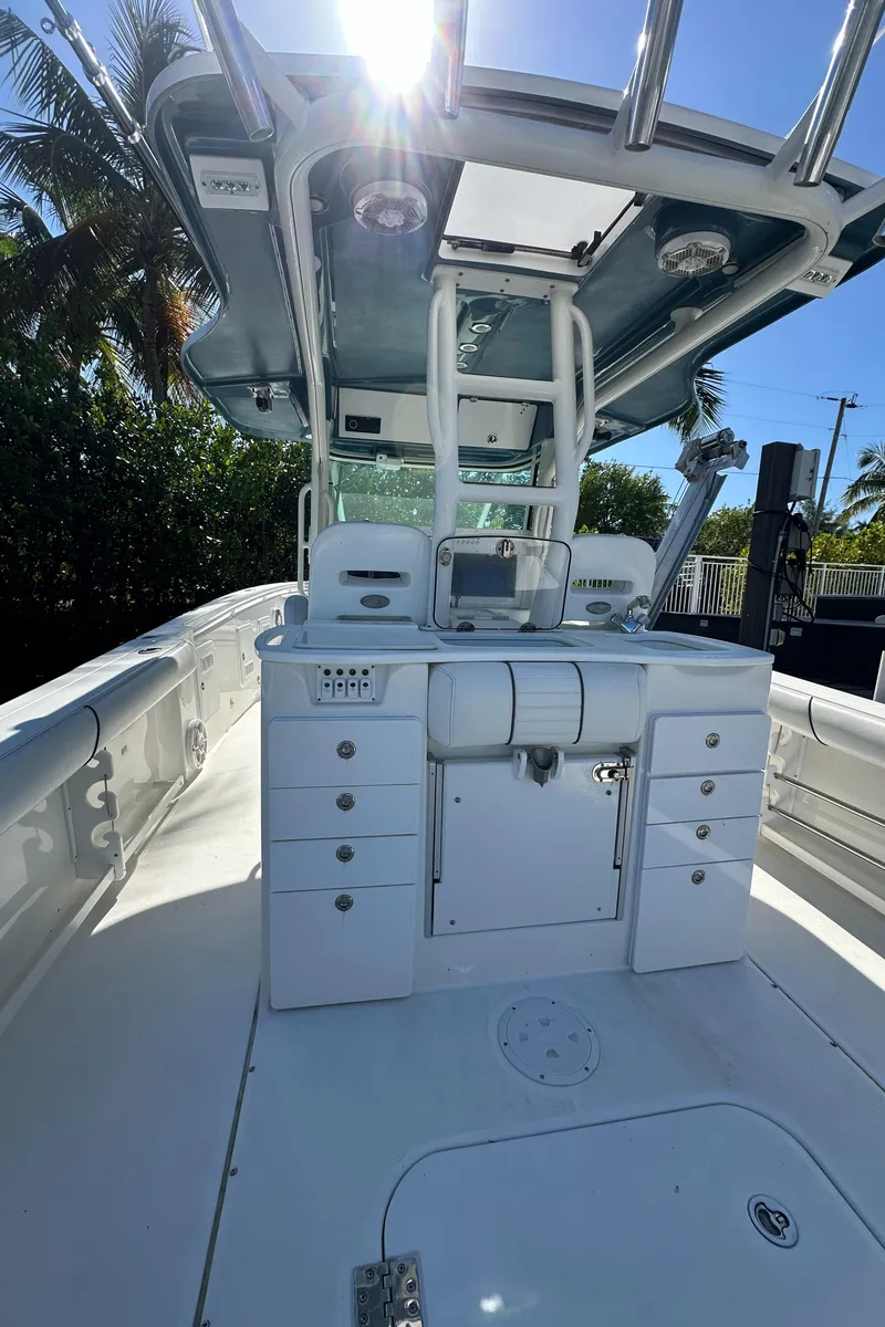 Slide: The Image of 2008 Everglades 350 CC boat interior with helm station and storage compartments. - 29