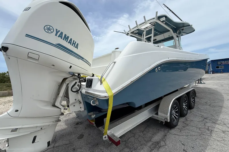 Slide: The Image of 2009 Everglades 350 Center Console boat with Yamaha engine on a trailer. - 3