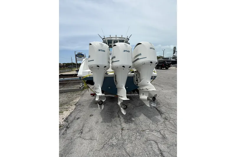 Slide: The Image of 2009 Everglades 350 Center Console with triple Yamaha 350 outboard engines. - 5