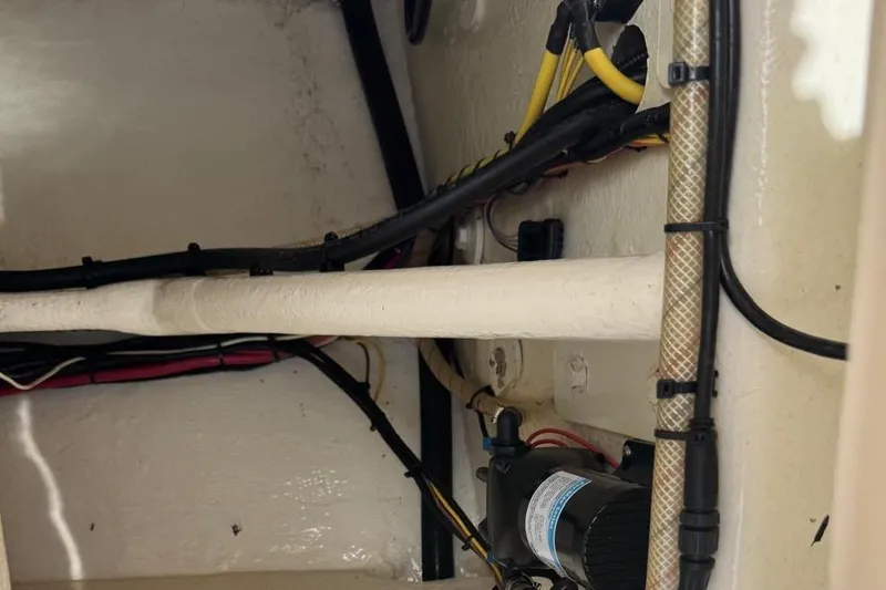 Slide: The Image of Interior wiring and components of a 2014 Latitude 28 CC boat. - 17