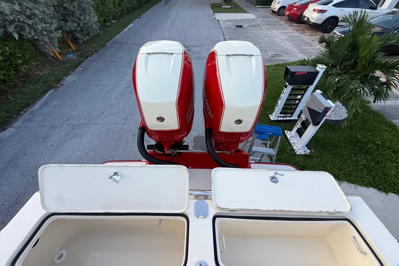 Slide: The Image of Top view of 2014 Latitude 46 28 CC boat with dual red outboard motors. - 28