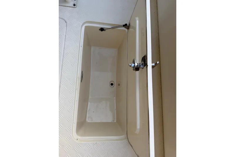 Slide: The Image of Open storage compartment on 2014 Custom Latitude Powerboats 28 CC. - 38