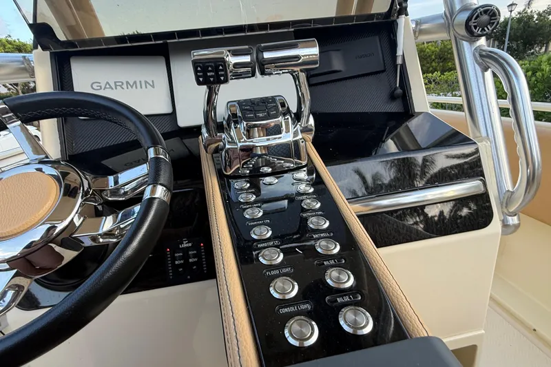 Slide: The Image of Control panel of 2014 Custom Latitude Powerboats 28 CC with Garmin navigation system. - 17