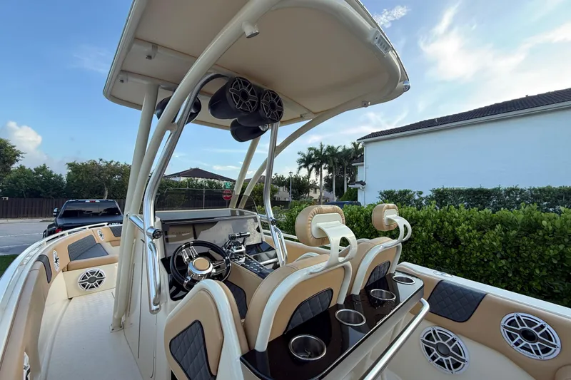 Slide: The Image of 2014 Custom Latitude Powerboats 28 CC with luxurious seating and modern dashboard. - 13