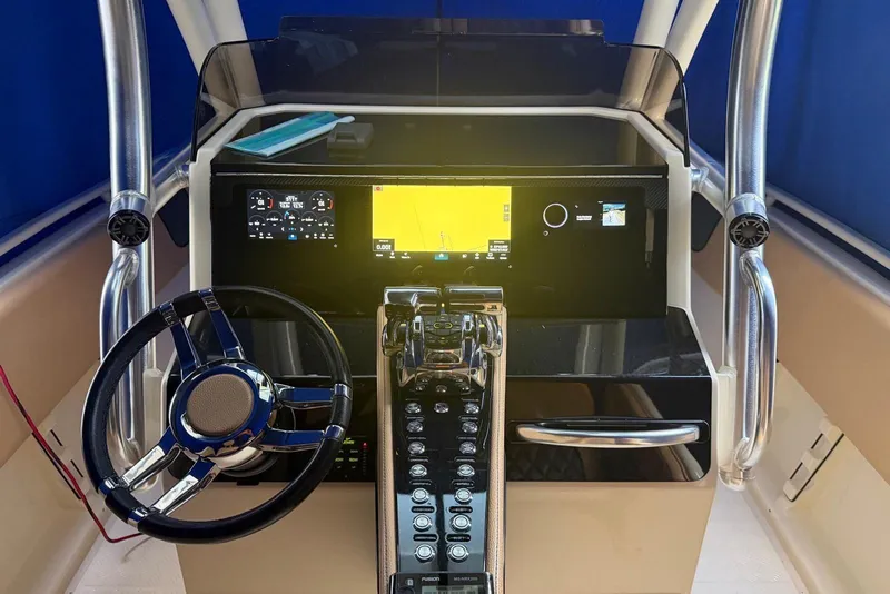 Slide: The Image of Steering console of 2014 Latitude 28 CC boat with modern navigation equipment. - 10