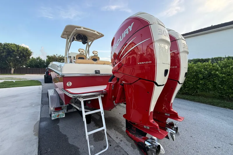 Slide: The Image of 2014 Latitude 46 28 CC boat with dual Mercury Verado engines on a trailer. - 25