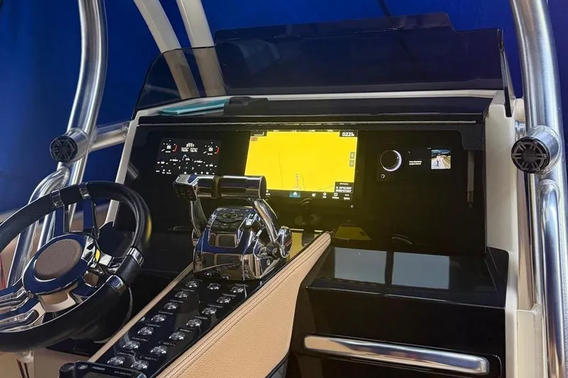 Slide: The Image of Cockpit of 2014 Latitude 28 CC boat with modern navigation system and steering wheel. - 7