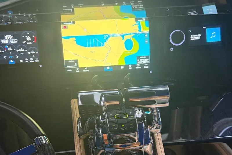 Slide: The Image of Dashboard of a 2014 Latitude 28 CC boat with navigation and control systems. - 9