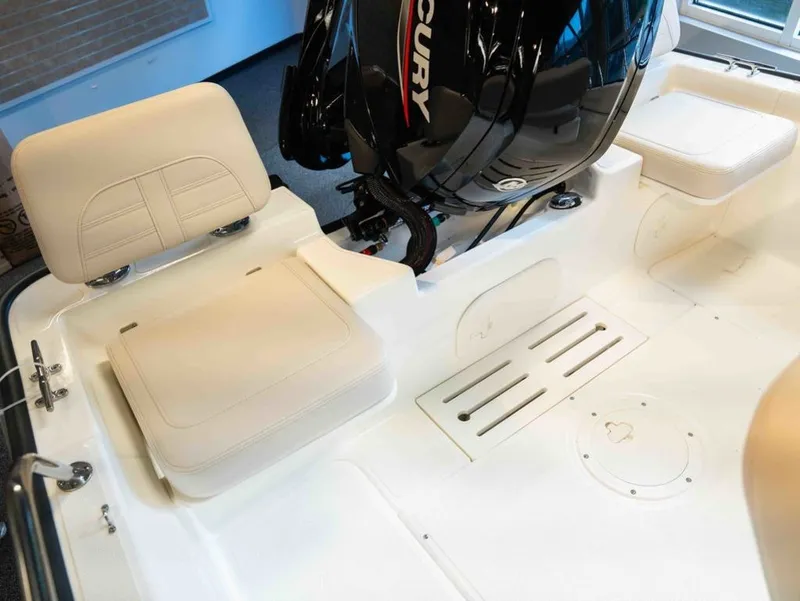 Slide: The Image of The image shows the cockpit of a Boston Whaler 170 Montauk with a Mercury outboard motor. - 5