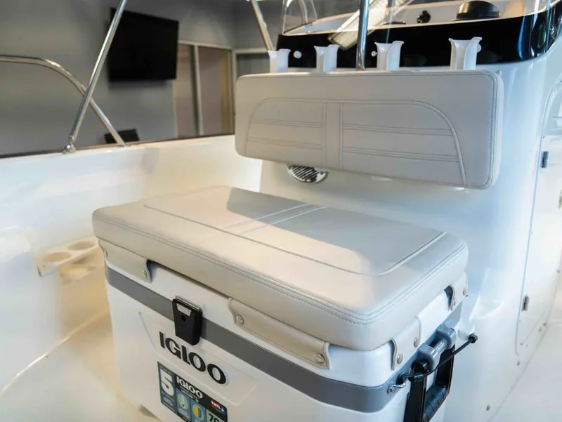 Slide: The Image of The image shows the cockpit of a Boston Whaler 170 Montauk with an Igloo cooler as a seat. - 12