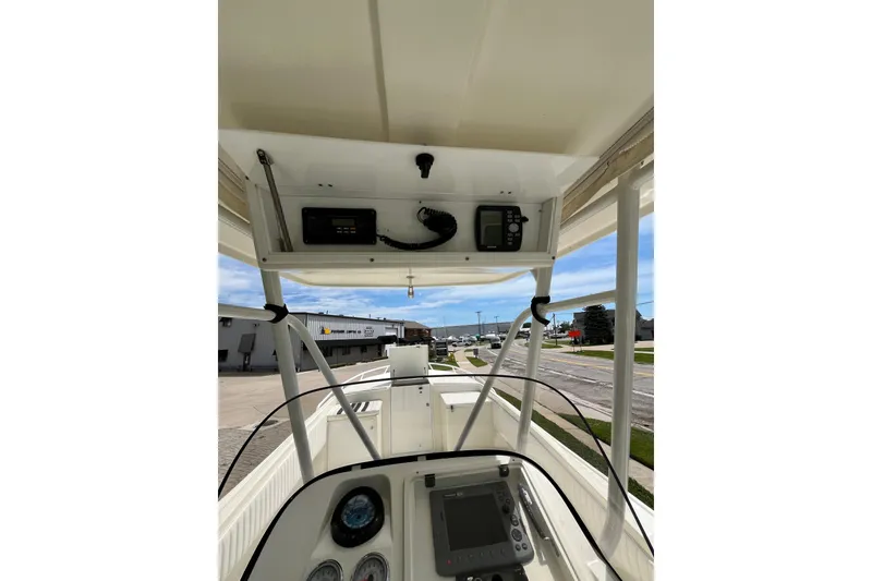 Slide: The Image of 1994 Intrepid 30 Open Cuddy boat dashboard with navigation equipment and controls. - 10