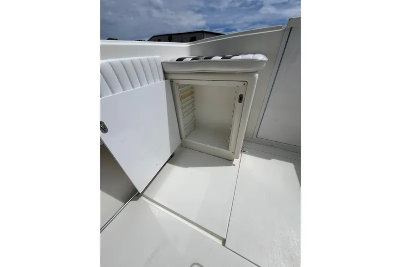 Slide: The Image of Open storage compartment on 1994 Intrepid 30 Open Cuddy boat deck. - 14