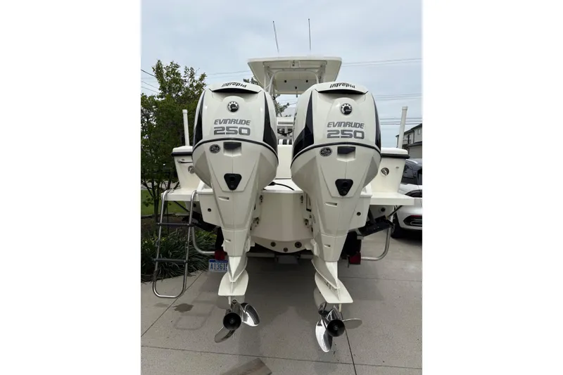 Slide: The Image of 1994 Intrepid 30 Open Cuddy with dual Evinrude 250 outboard engines, rear view. - 17