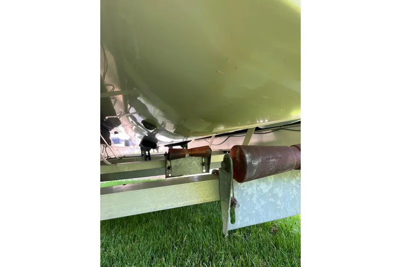 Slide: The Image of Underneath view of a 1994 Intrepid 30 Open Cuddy boat on a trailer. - 21