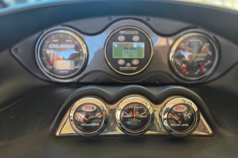 Slide: The Image of Dashboard of a 2007 Calabria CAL AIR PRO V boat with gauges and controls. - 17