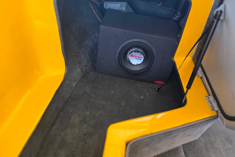 Slide: The Image of 2007 Calabria CAL AIR PRO V interior with Boston subwoofer in yellow compartment. - 18