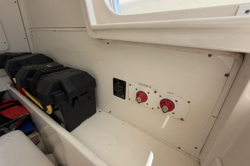 Slide: The Image of 2009 SeaVee 340B Cuddy interior with battery switches and storage compartments. - 17