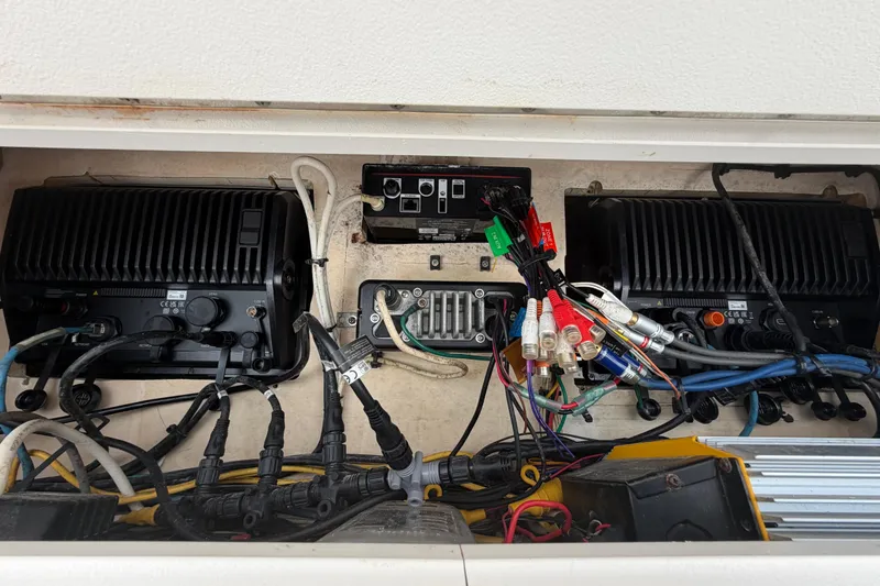 Slide: The Image of Electrical components and wiring inside a 2009 SeaVee 340B Cuddy boat. - 18