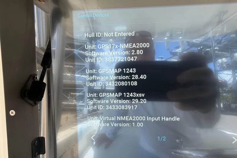 Slide: The Image of Garmin device display on 2009 SeaVee 340B Cuddy, showing software versions and unit IDs. - 19