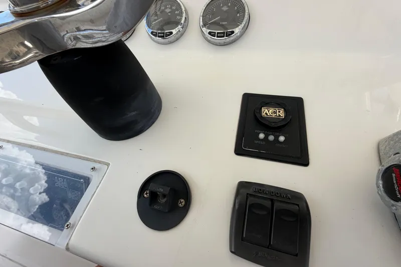 Slide: The Image of 2009 SeaVee 340B Cuddy dashboard with controls and gauges. - 21