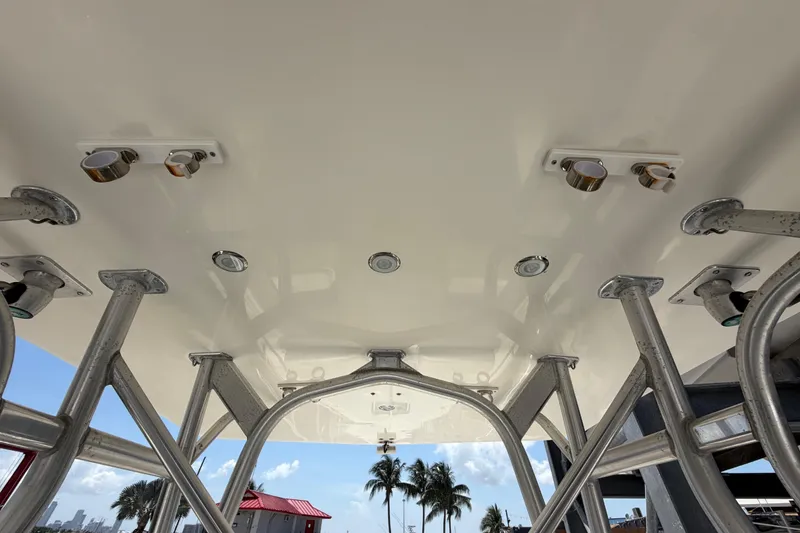 Slide: The Image of 2009 SeaVee 340B Cuddy boat's underside view with metal framework and lighting fixtures. - 24
