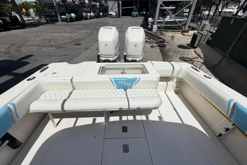 Slide: The Image of 2009 SeaVee 340B Cuddy boat with twin engines and cushioned seating. - 27
