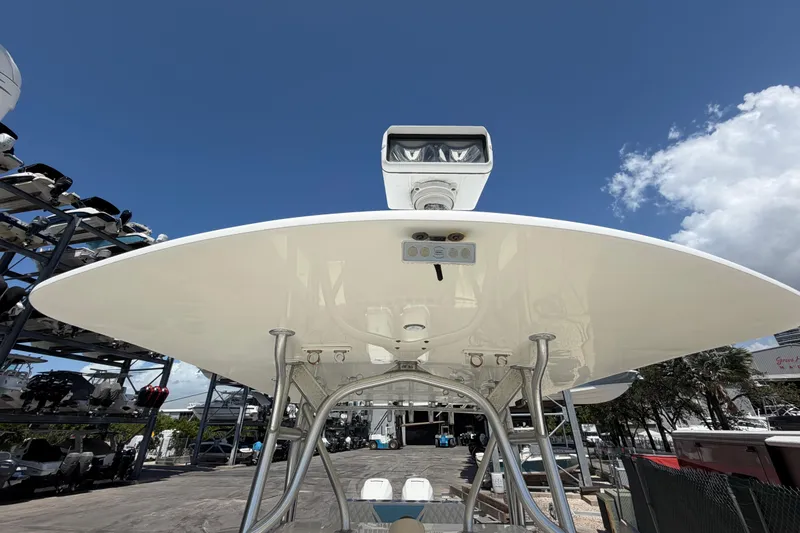 Slide: The Image of 2009 SeaVee 340B Cuddy boat with radar, viewed from below against a clear sky. - 32