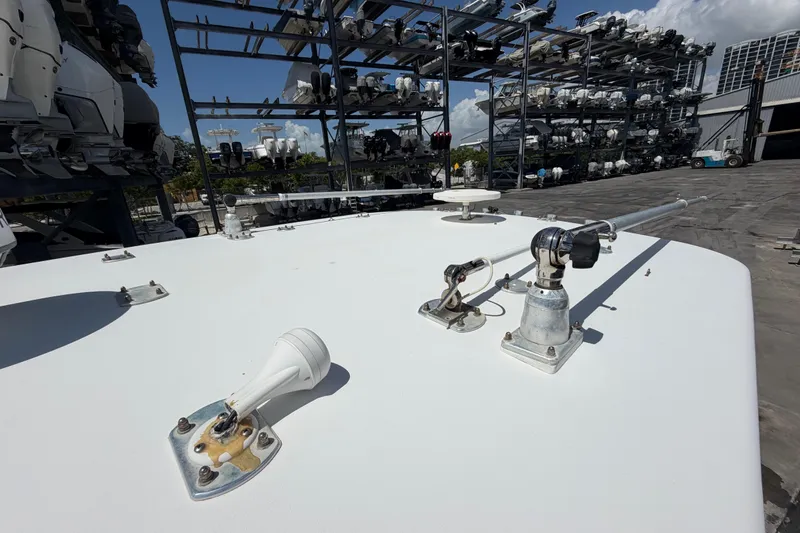 Slide: The Image of 2009 SeaVee 340B Cuddy boat deck with antennas, stored in a marina. - 34
