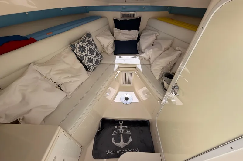 Slide: The Image of 2009 SeaVee 340B Cuddy interior with cushions and welcome mat. - 35