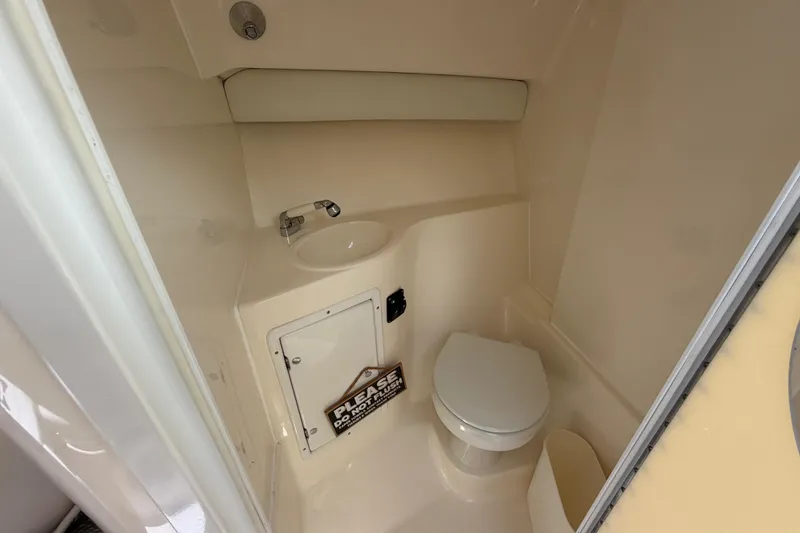Slide: The Image of 2009 SeaVee 340B Cuddy boat bathroom with toilet and sink. - 39