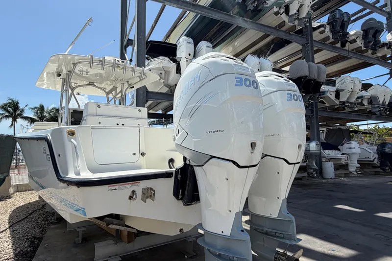 Slide: The Image of 2009 SeaVee 340B Cuddy boat with twin Mercury 300 engines in a marina storage. - 4