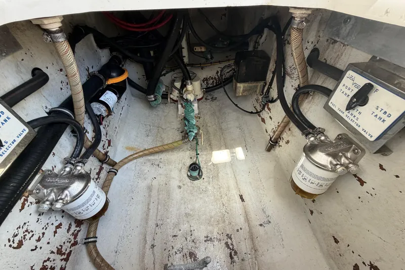 Slide: The Image of 2009 SeaVee 340B Cuddy engine compartment with fuel filters and hoses. - 40