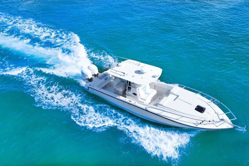 Slide: The Image of 2009 SeaVee 340B Cuddy cruising on clear blue water. - 41