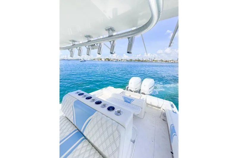 Slide: The Image of 2009 SeaVee 340B Cuddy boat with twin engines on open water. - 44