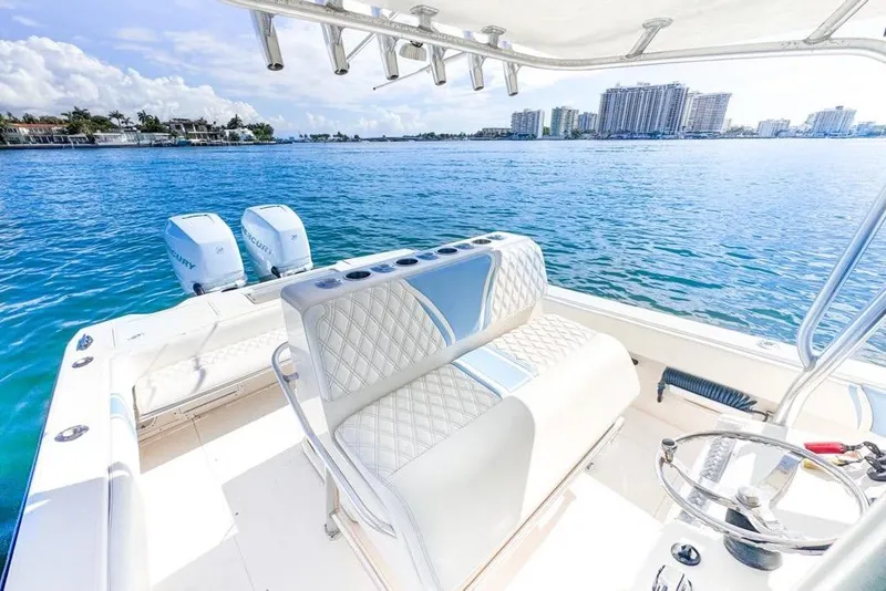 Slide: The Image of 2009 SeaVee 340B Cuddy boat with dual Mercury engines on a sunny day. - 49