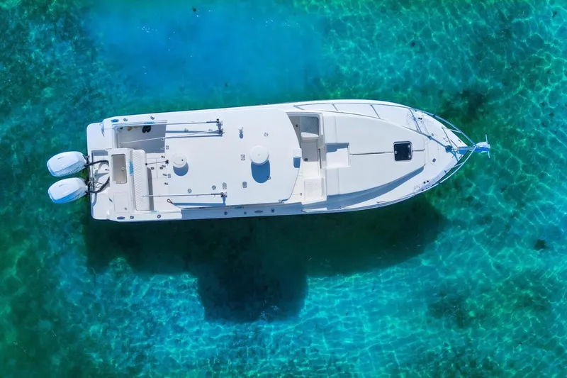 Slide: The Image of Aerial view of 2009 SeaVee 340B Cuddy boat on clear turquoise water. - 50