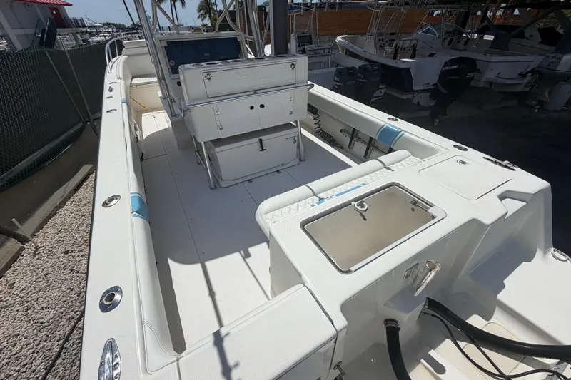 Slide: The Image of 2009 SeaVee 340B Cuddy boat interior with seating and storage compartments. - 8