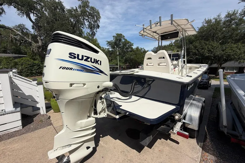 Slide: The Image of 1976 SeaCraft SC 23 Classic boat with Suzuki Four Stroke engine on trailer. - 11
