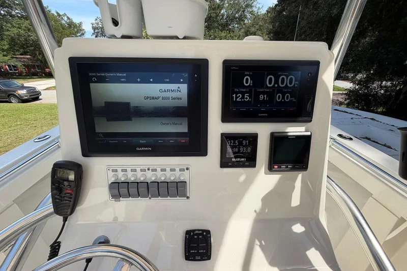 Slide: The Image of 1976 SeaCraft SC 23 Classic boat dashboard with Garmin GPSMAP 8000 Series displays. - 17