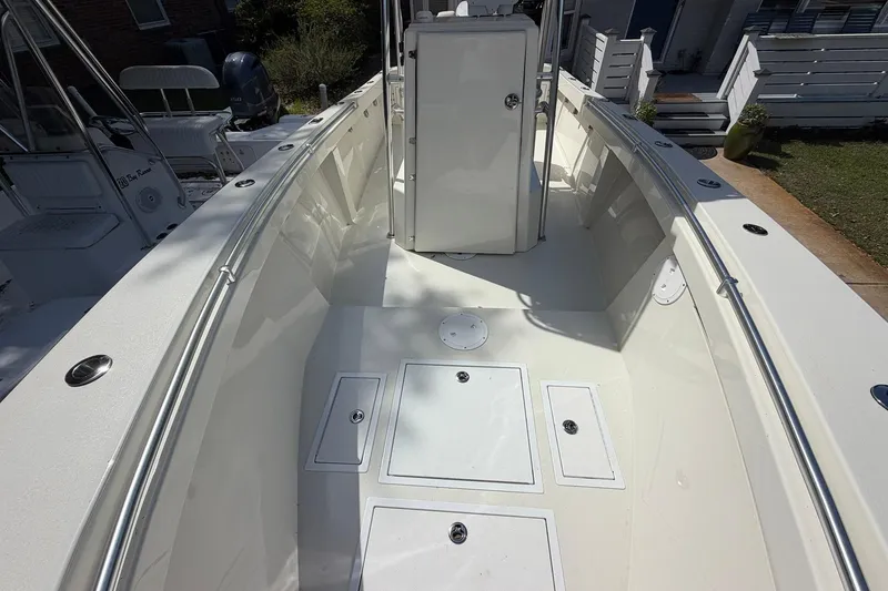 Slide: The Image of 1976 SeaCraft SC 23 Classic boat interior with clean white deck and storage compartments. - 21
